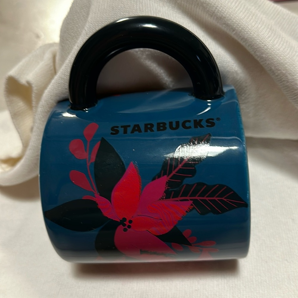 Starbucks, poinsettia, coffee mug, with poinsettia graphics all around mug